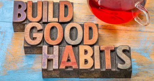 Illustration of building blocks spelling out 'Build Good Habits.'